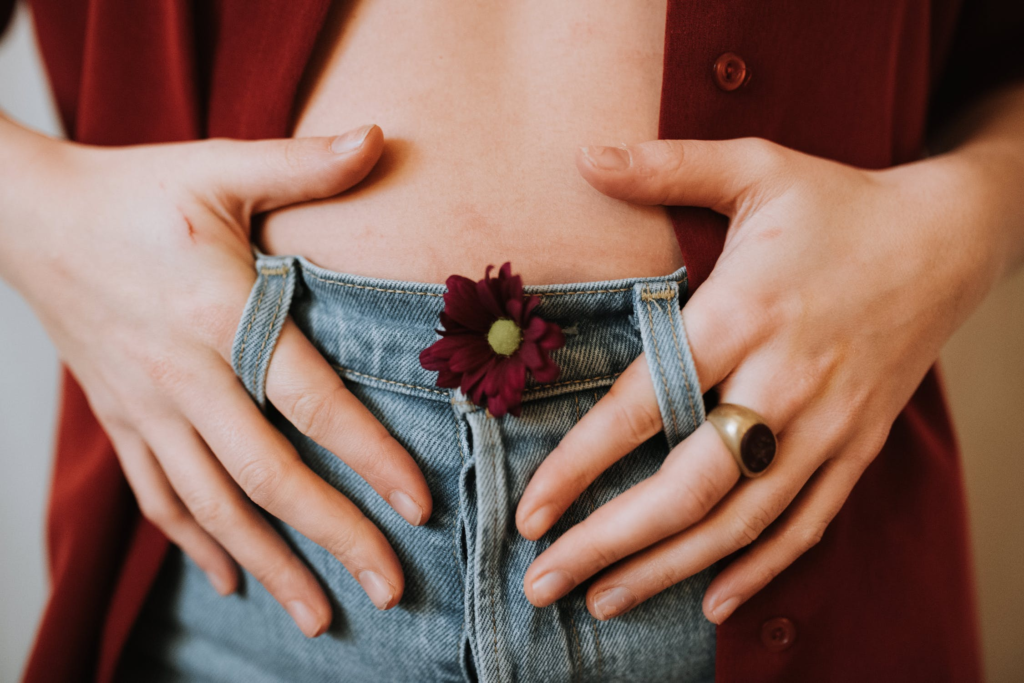 woman showing her gut