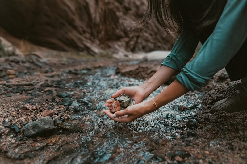 woman exploring mountain river