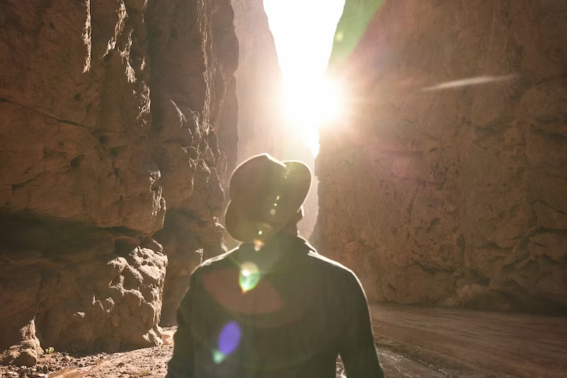 man looking at the sunlight