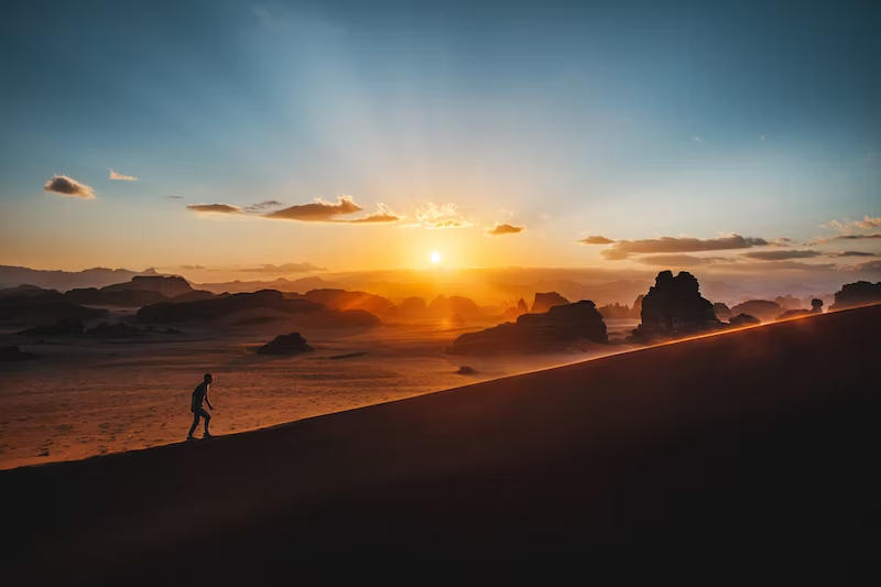 sunset, man climbing mountain