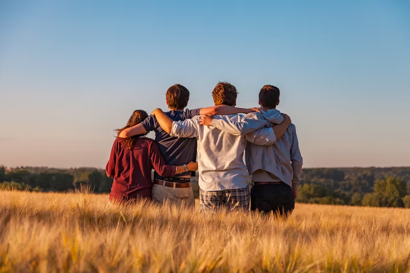 group of friends in summer hugging