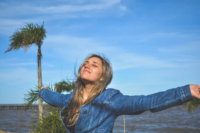 happy woman in blue background