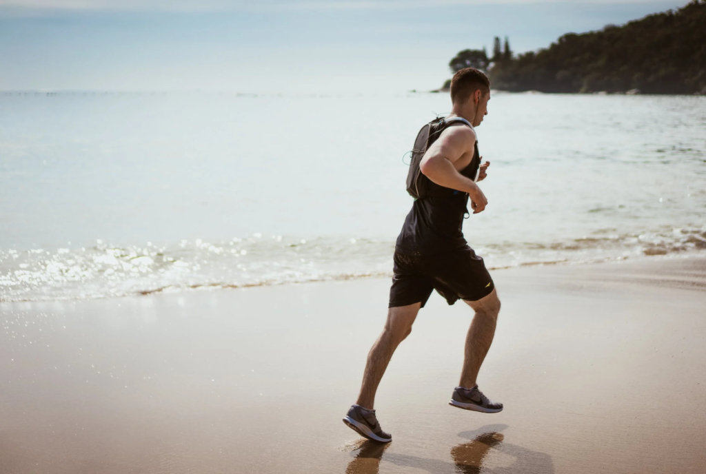 man exercising by the beach